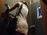 Asian girl in the dressing room with hidden cam