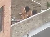 Tranny and girl fuck on the roof of the house