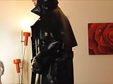 Rubber Mistress M wanks on Floor